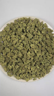 PUFFY Kosher Kush is an indica-dominant hybrid THCa strain consistently linked back to strong OG Kush genetics as its primary ancestral source. The aroma presents sharp pine and zesty lemon notes layered with distinct chemical undertones. Visually, dense forest green buds with hints of purple are threaded with fiery orange pistils and coated in a sparkling layer of sticky trichomes. Consumers often report a euphoric full-body relaxation that helps calm the mood while promoting a light sense of mental ease, 