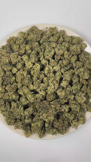 PUFFY Pop Rocks is an indica-dominant THCa strain, a vibrant cross between LA Pop Rocks and Magic Marker. The aroma unfolds with a vibrant blend of sweet candy notes, layered with bold fuel-like sharpness and a burst of juicy, ripe fruit undertones. Visually, dense green buds with purple hues and fiery orange pistils are coated in sticky trichomes. Consumers often report a soothing body high paired with mood enhancement, including feelings of happiness, calm, and mild euphoria, making it ideal for unwinding