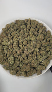 PUFFY Baby Jokerz is an indica-dominant hybrid THCa strain, created from the legendary pairing of White Runtz and Jet Fuel Gelato. The aroma is a delightful blend of sweet grape, delicate floral notes, and subtle herbal undertones, creating a fragrant and inviting scent. Visually, the buds are dense and rich in color, showcasing deep green and purple hues, vibrant orange pistils, and a generous coating of glistening trichomes. Consumers often report an initial euphoria, heightened focus, and an uplifted moo