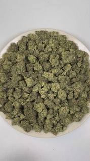 PUFFY Frozen Jelly is an indica-dominant hybrid THCa strain crafted through the genetic blending of Jelly Breath and Permafrost. The aroma opens with a vibrant blend of sweet fruity notes and delicate floral undertones, layered with a rich fuel-like depth. Visually, dense forest green buds with purple hues and fiery orange pistils are coated in sticky trichomes. Consumers often report a euphoric sense of uplift paired with a relaxed body sensation, delivering clear-headed calm and effective stress relief wh