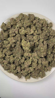 PUFFY Blue Ritz is an indica-dominant hybrid THCa strain emerging from the carefully selected cross of  Blue Candy and R.I.T.Z. The aroma is a rich blend of sweet grape and juicy berries, rounded out by a distinct gassy finish. Visually, dense deep forest green buds with purple hues and fiery orange pistils are coated in sticky trichomes. Consumers often report euphoric and uplifting effects paired with a soothing sense of relaxation. 