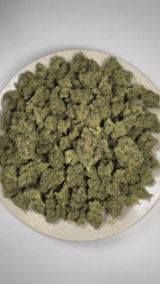 PUFFY Blue Zushi is an indica-dominant hybrid THCa strain expertly bred from the distinctive pairing of Original Z and Kush Mints. The aroma is a vibrant blend of fruity and tropical notes, complemented by a sweet, juicy finish of ripe berries. Visually, dense forest green buds with purple hues and fiery orange pistils are coated in sticky trichomes. Consumers often report a euphoric, uplifted experience with a creative boost, easygoing relaxation, and an overall calm, positive mood. 