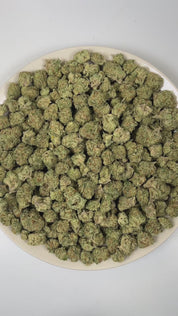 PUFFY Papaya Punch is an indica-dominant hybrid THCa strain crafted from the flavorful union of Papaya and Purple Punch. The aroma opens with a lush burst of ripe papaya and creamy banana, layered over bright tropical fruit notes. Visually, dense forest green buds with purple hues and fiery orange pistils are coated in sticky trichomes. Consumers often report a smooth high, beginning with a gentle cerebral uplift that sparks creativity and lighthearted conversation, then gradually flowing into deep, full-bo
