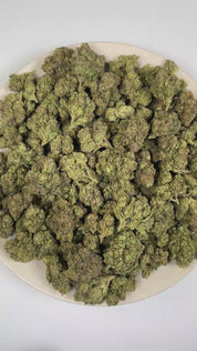 PUFFY Blueberry Gelato is an indica THCa strain crafted through the masterful blend of Thin Mint Girl Scout Cookies and Blueberry. The aroma presents a bold fusion of pungent fuel, ripe fruity sweetness, and rich gassy undertones. Visually, dense deep forest green buds with purple hues and fiery orange pistils are coated in sticky trichomes. Consumers often report experiencing a euphoric, deeply relaxed sensation that helps promote a calm, uplifting mood while encouraging overall physical and mental ease. 