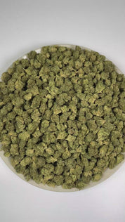 PUFFY Gorilla Glue (smalls) is a balanced hybrid THCa strain emerging from the complex union of  Chem’s Sister, Sour Dubb, and Chocolate Diesel. The aroma is rich with herbal notes, warm woody undertones, and a subtle layer of aromatic spice. Visually, dense forest green buds with purple hues and fiery orange pistils are coated in sticky trichomes. Consumers often report feeling euphoric and uplifted, with a focused yet deeply relaxed experience.  