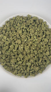 PUFFY Lemon Bananas (smalls) is a balanced hybrid THCa strain expertly crafted with an air of mystery, with Banana Kush being the most commonly suggested influence. The aroma is a vibrant fusion of ripe bananas, zesty lemon, and exotic tropical notes. Visually, dense spring green buds with purple hues and fiery orange pistils are coated in sticky trichomes. Consumers often report a euphoric and uplifting sense of happiness, paired with a spark of creativity and clear mental focus, balanced by smooth, flowin