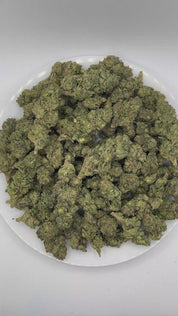 PUFFY Tomahawk is a balanced hybrid THCa strain emerging from the distinguished pairing of GG4 (Gorilla Glue 4) and Stardawg. The aroma opens with bold gassy and herbal notes, finishing with a distinctive peppery kick. Visually, dense lush green buds with purple hues and fiery orange pistils are coated in sticky trichomes. Consumers often report a euphoric and uplifting experience that promotes a clear, focused mindset while delivering an energetic boost to keep them feeling motivated and engaged.