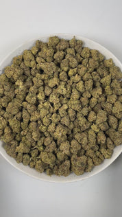 PUFFY Kiwi Strawberry is a sativa-dominant  hybrid THCa strain, most reliable sources note that its exact lineage remains largely unverified. The aroma unfolds with sweet strawberry notes, layered with delicate floral undertones and a subtle earthy richness. Visually, dense forest green buds with purple hues and fiery orange pistils are coated in sticky trichomes. Consumers often report an uplifting, energizing cerebral buzz that sparks euphoria and sociability, promoting chatty, inspired, and creative mood