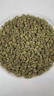 PUFFY Sour Tangie (smalls) is a sativa-dominant hybrid THCa strain, hailing from the legendary genetics of East Coast Sour Diesel and Tangie. The aroma opens with bright, zesty tangerine notes, layered with a sweet undertone and a subtle hint of rubbery earthiness, creating a uniquely vibrant and intriguing scent. Visually, the dense buds display rich forest-green tones with hints of purple, accented by vibrant orange pistils and enveloped in a frosty layer of trichomes. Consumers often report a cerebral, u