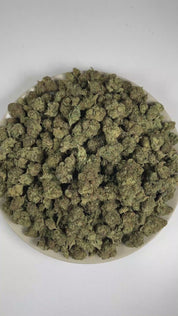 PUFFY Girl Scout Cookies is an Indica-dominant hybrid THCa strain born from the legendary cross of OG Kush and Durban Poison. The aroma blends cool mint and refined nutty notes, complemented by a lingering sweet finish. Visually, dense forest green buds with purple hues and fiery orange pistils are coated in sticky trichomes. Consumers often report a euphoric high that uplifts the mood, promoting a soothing sense of calm, easing tension, and encouraging a focused mental state.  