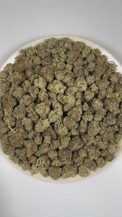 PUFFY Pink Champagne is an indica-dominant hybrid THCa strain bred from the exceptional pairing of Granddaddy Purple and Cherry Pie. The aroma is a rich and inviting blend of ripe plum, delicate roses, and sweet, juicy berries, creating a fragrant profile that is both floral and fruity. Visually, dense forest green buds with purple hues and fiery orange pistils are coated in sticky trichomes. Consumers often report a euphoric, relaxed, and calm body high that may help ease stress and restlessness, promoting