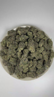 PUFFY Blue Candy is a balanced hybrid THCa strain, crafted from the flavorful union of Blueberry and Cotton Candy Kush. The aroma is an indulgent fusion of luscious candy and ripe berries, elevated by a rich, sophisticated gassy finish. Visually, dense deep forest green buds with purple hues and fiery orange pistils are coated in sticky trichomes. Consumers often report a euphoric and uplifting cerebral buzz that sparks creativity and conversation, paired with a deeply relaxing and calming body effect.  
