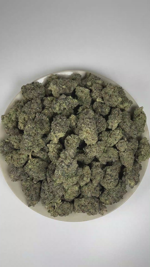 PUFFY Blue Candy is a balanced hybrid THCa strain, crafted from the flavorful union of Blueberry and Cotton Candy Kush. The aroma is an indulgent fusion of luscious candy and ripe berries, elevated by a rich, sophisticated gassy finish. Visually, dense deep forest green buds with purple hues and fiery orange pistils are coated in sticky trichomes. Consumers often report a euphoric and uplifting cerebral buzz that sparks creativity and conversation, paired with a deeply relaxing and calming body effect.  
