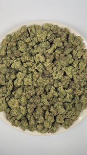 PUFFY Galactic Candy is a sativa-dominant hybrid THCa strain crafted from the standout genetics of Orange Velvet and Space Queen. The aroma is a striking blend of sweet candy-like notes layered with sharp diesel undertones and bright, zesty citrus. Visually, dense forest green buds with purple hues and fiery orange pistils are coated in sticky trichomes. Consumers often report a euphoric and cerebral rush that boosts focus and motivation, transitioning into a mild calming body relaxation.