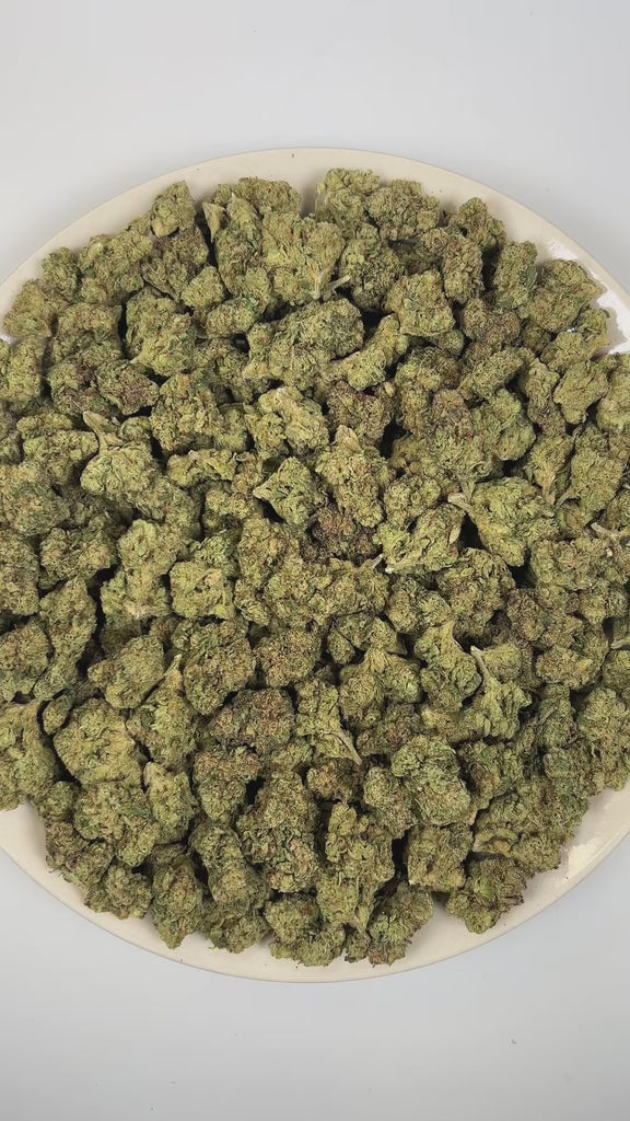 PUFFY Galactic Candy is a sativa-dominant hybrid THCa strain crafted from the standout genetics of Orange Velvet and Space Queen. The aroma is a striking blend of sweet candy-like notes layered with sharp diesel undertones and bright, zesty citrus. Visually, dense forest green buds with purple hues and fiery orange pistils are coated in sticky trichomes. Consumers often report a euphoric and cerebral rush that boosts focus and motivation, transitioning into a mild calming body relaxation.