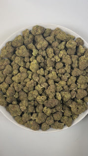 PUFFY Bacio Gelato is a premium balanced hybrid THCa strain born from the legendary cross of Sunset Sherbert and Thin Mint Girl Scout Cookies. The aroma is a rich and intriguing blend of sweet licorice, decadent chocolate, and pungent gassy undertones. Visually, buds are dense and chunky, with forest green and purple tones, fiery orange pistils, and a frosty trichome coating. Consumers describe it as gentle yet uplifting, providing clear-headed calm and a subtle mood boost that eases tension while keeping y