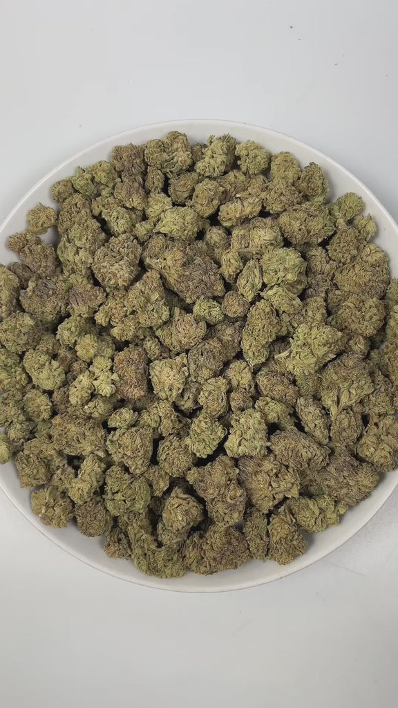 PUFFY Bolato is an indica-dominant hybrid THCa strain, expertly crafted from a premium blend of Curelato, Runtz, and Lemon Cherry Gelato. The aroma is a rich blend of herbal, woody, and smokey notes, creating a deep, earthy scent that lingers pleasantly in the air. Visually, dense green buds with purple hues and fiery orange pistils are coated in sticky trichomes. Consumers often report a euphoric and deeply relaxing experience that helps reduce stress while potentially easing both anxiety and physical disc