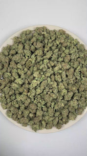 PUFFY Kush Mints (smalls) is a balanced hybrid THCa strain meticulously crafted through the expert crossbreeding of Animal Mints and Bubba Kush. The aroma opens with a rich doughy sweetness layered with fresh pine and warm spice notes. Visually, the buds are dense, with deep green and purple hues, bright orange pistils, and a sparkling coating of trichomes. Consumers often report euphoric effects paired with deep relaxation and body calm, enhanced mental clarity, often accompanied by feelings of contentment