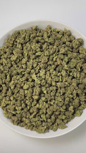 PUFFY King Gelato (smalls) is an indica-dominant hybrid THCa strain created from the potent pairing of High Octane and Curelato. The aroma presents a bold, fuel-like gasoline note, layered with sharp chemical undertones and rounded out by a smooth, rich buttery scent for a complex and striking fragrance. Visually, the dense buds showcase deep forest greens with dark accents, bright orange pistils, and a thick layer of sparkling trichomes. Consumers often describe an invigorating yet soothing experience, whe