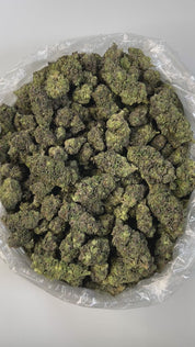 PUFFY Sour Patch Kids is a sativa-dominant hybrid THCa strain born from the flavorful fusion of Sour Diesel and Candyland. The aroma is a playful blend of candy sweetness, fruity brightness, and creamy undertones, all seamlessly mirroring its indulgent flavor. Visually, the buds are striking bright green with hints of purple, threaded with golden-orange pistils, and coated in a dense, frosty layer of trichomes. Consumers often describe the experience as happy and uplifting, with a clear mental focus, a slig