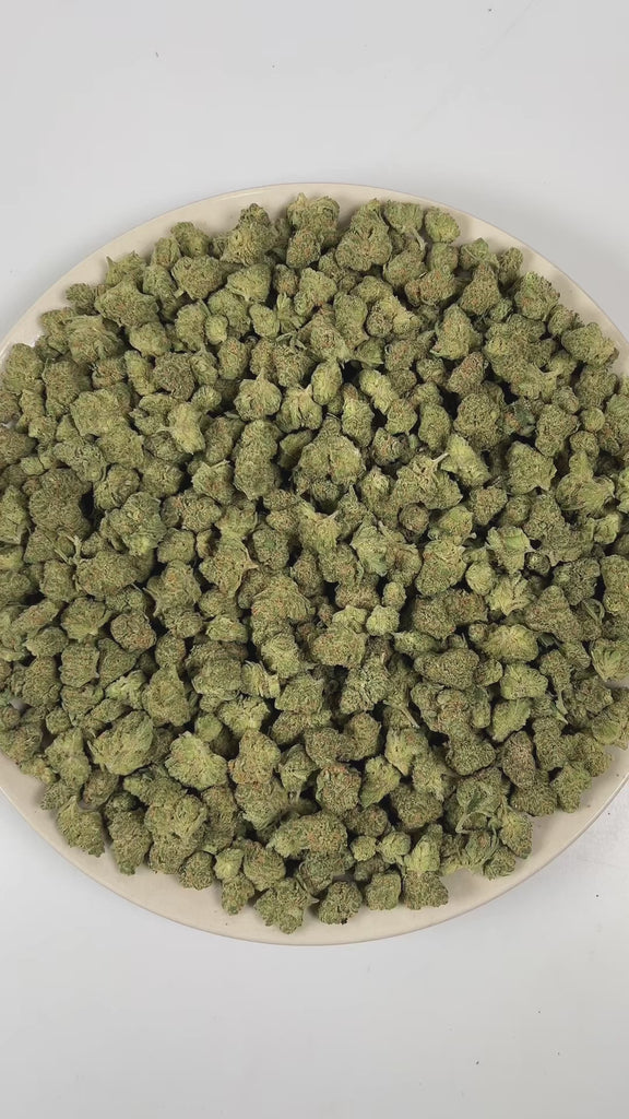 PUFFY Blue Skunk (smalls) is an indica-dominant hybrid THCa strain, born from the exotic blend of Blueberry and Skunk. The aroma is a bold blend of sweet blueberries layered with funky, earthy undertones and a distinct cheesy richness that adds depth and complexity. Visually, buds are dense and frosty, featuring deep green and purple hues with bright orange pistils and a thick coating of sparkling trichomes. Consumers often report a relaxing and euphoric experience accompanied by bursts of laughter, along w