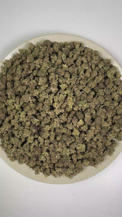 PUFFY Black Magic (smalls) is a lush indica THCa strain with a genetic lineage that remains undisclosed, adding an air of mystery to its unknown heritage. The aroma features earthy herbal notes complemented by a sharp peppery kick and pungent, gassy undertones. Visually, dense forest green buds with purple hues and fiery orange pistils are coated in sticky trichomes. Consumers often report feeling euphoric and uplifted, accompanied by a calm, relaxing sensation.