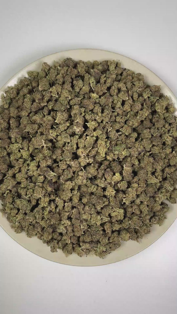PUFFY Black Magic (smalls) is a lush indica THCa strain with a genetic lineage that remains undisclosed, adding an air of mystery to its unknown heritage. The aroma features earthy herbal notes complemented by a sharp peppery kick and pungent, gassy undertones. Visually, dense forest green buds with purple hues and fiery orange pistils are coated in sticky trichomes. Consumers often report feeling euphoric and uplifted, accompanied by a calm, relaxing sensation.