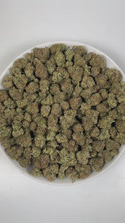 PUFFY Grape Gasoline is a balanced hybrid THCa strain, created from the fusion of Jet Fuel Gelato and Grape Pie. The aroma is a rich blend of earthy notes layered with herbal tones and a hint of warm spice. Visually, it shows deep violet tones with green leaves, orange pistils, and a sparkling coat of trichomes. Consumers often report a stimulating, blissful high that ignites creativity while a gentle body relaxation eases stress and enhances focus, ideal for social moments or creative pursuits.