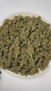 PUFFY Super Lemon Haze is a sativa-dominant hybrid THCa strain crafted through the refined pairing of  Lemon Skunk and Super Silver Haze. The aroma opens with sharp notes of fresh lemons and pungent chemical undertones, finishing with a bright, zesty burst. Visually, dense vivid green buds with purple hues and fiery orange pistils are coated in sticky trichomes. Consumers often report that it provides an energizing boost, elevates mood with a sense of euphoria, and sharpens mental clarity and alertness. 