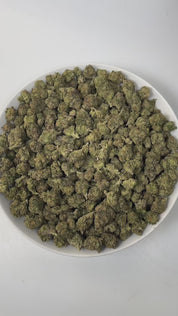 PUFFY Lemon Cherry Gelato is an indica-dominant  hybrid THCa strain, expertly crafted from a potent cross between Sunset Sherbet and Girl Scout Cookies. The aroma is a delightful blend of cherry, sweet, and creamy notes, creating an inviting and luscious scent that instantly captivates the senses. Visually, buds are dense and frosty, featuring deep green and purple hues with bright orange pistils and a thick coating of sparkling trichomes. Consumers often report an initial wave of uplifted, happy euphoria, 
