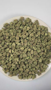 PUFFY Strawberry Biscotti (smalls) is a balanced hybrid THCa strain crafted through the masterful blend of Strawberry Kush and Biscotti Sundae. The aroma opens with the sweet, juicy scent of ripe strawberries, layered with smooth, creamy undertones and finished by a rich, freshly baked doughy warmth. Visually, dense forest green buds with purple hues and fiery orange pistils are coated in sticky trichomes. Consumers often report an uplifting sense of euphoria that sparks creativity and mental clarity before