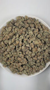 PUFFY Blueberry Muffin is an indica-dominant hybrid THCa strain, crafted by crossing the renowned Blueberry with Purple Panty Dropper. The aroma bursts with vibrant fruity notes, accented by a sweet, candy-like essence and lively, zesty highlights that create an invigorating and uplifting scent. Visually, the buds are dense, with rich green and purple tones, bright orange pistils, and a frosty layer of trichomes. Consumers often report a euphoric, uplifting experience that gently elevates mood, eases tensio