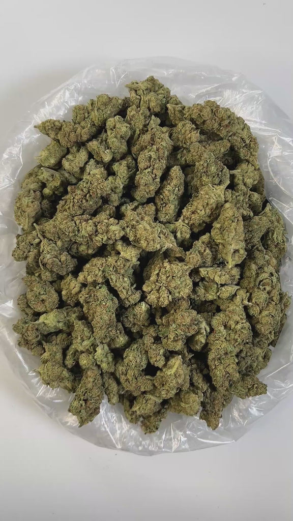PUFFY Tangie is a sativa-dominant hybrid THCa strain born from the flavorful lineage of California Orange (Cali-O) and Skunk #1. The aroma is a funky fusion of ripe strawberries, tangy blue cheese, and bright oranges, a profile that's boldly mirrored in its flavor. Visually, the buds are dense and frosty, with thick, silvery-white trichomes that give the colas a shimmering, snow-covered appearance. Consumers often describe the effects as energizing and euphoric, delivering a clear-headed, cerebral high that